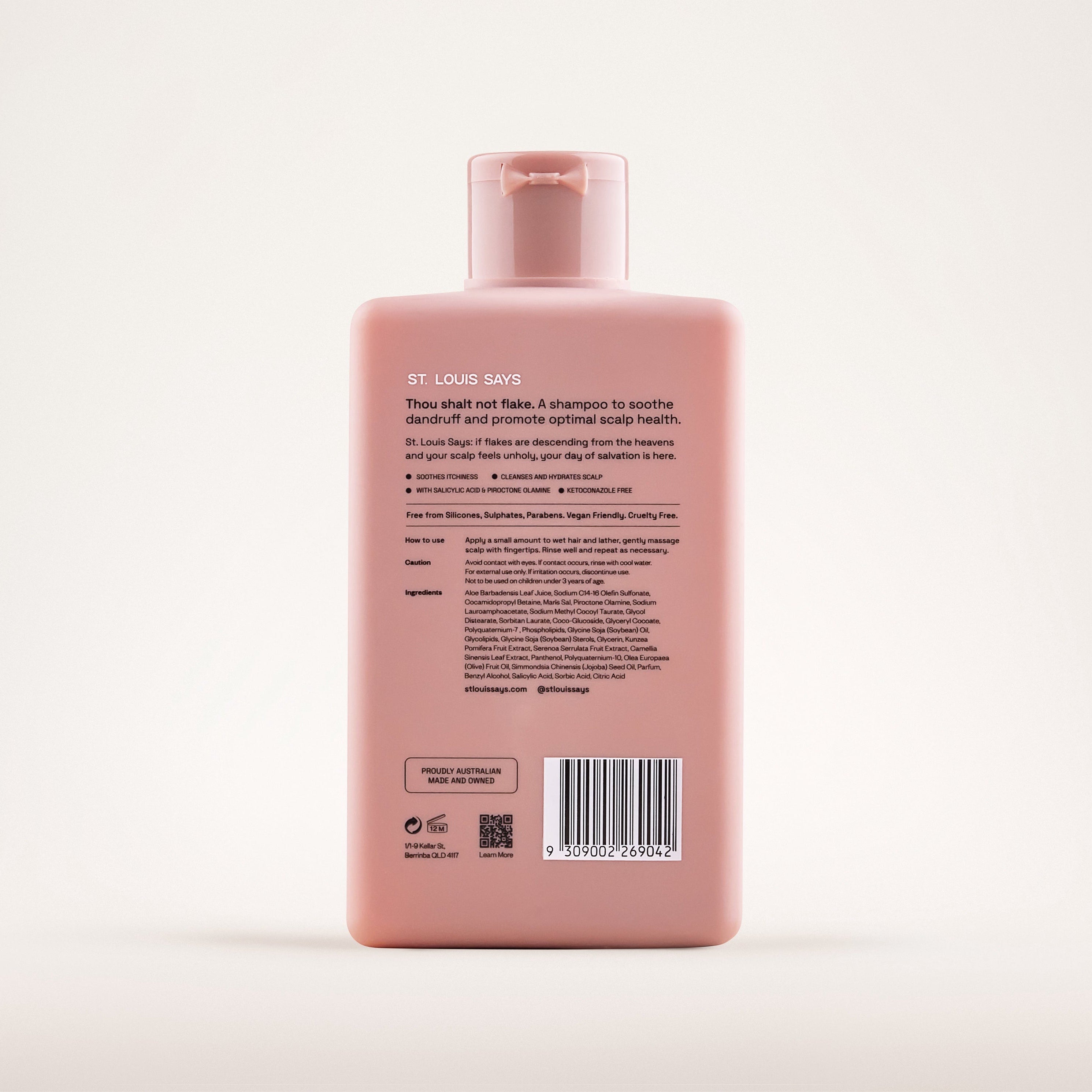 Pink shampoo bottle with label on a white background