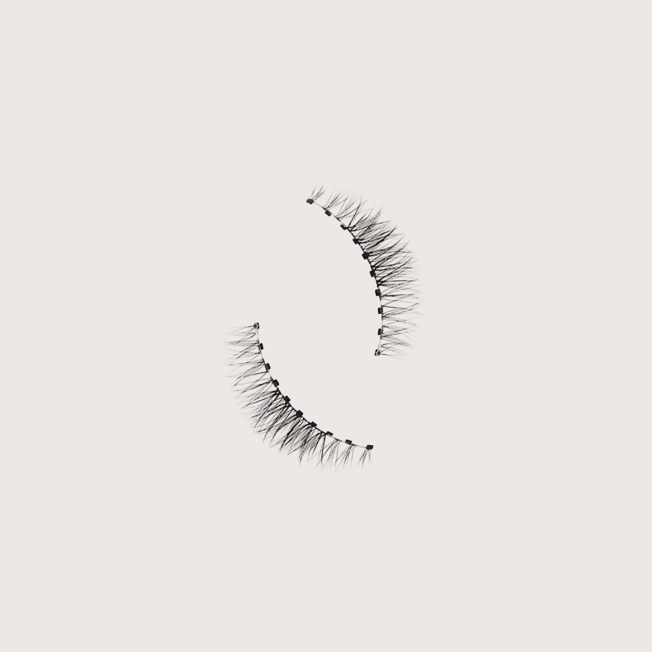Pair of false eyelashes on a white background
