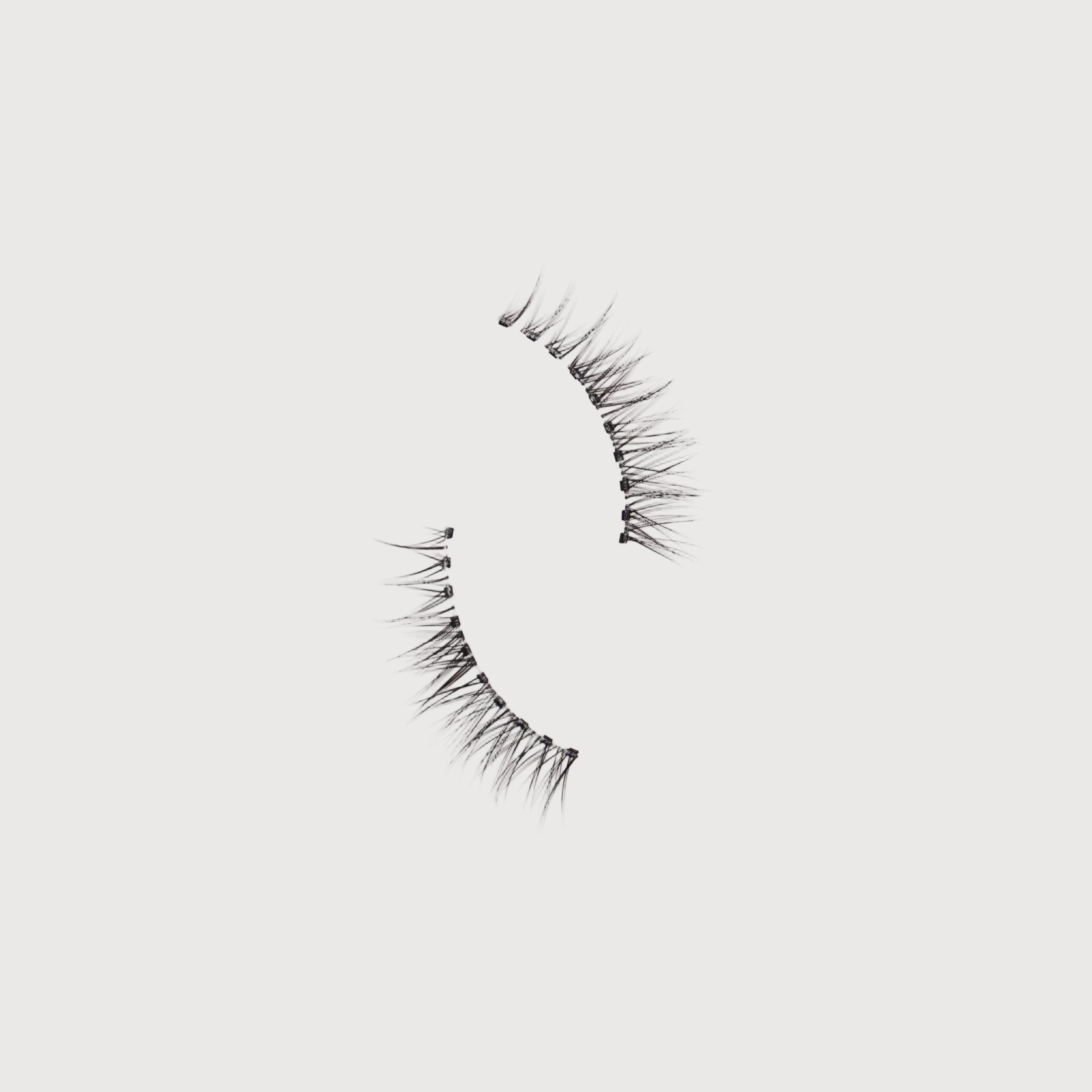 Pair of false eyelashes on a white background
