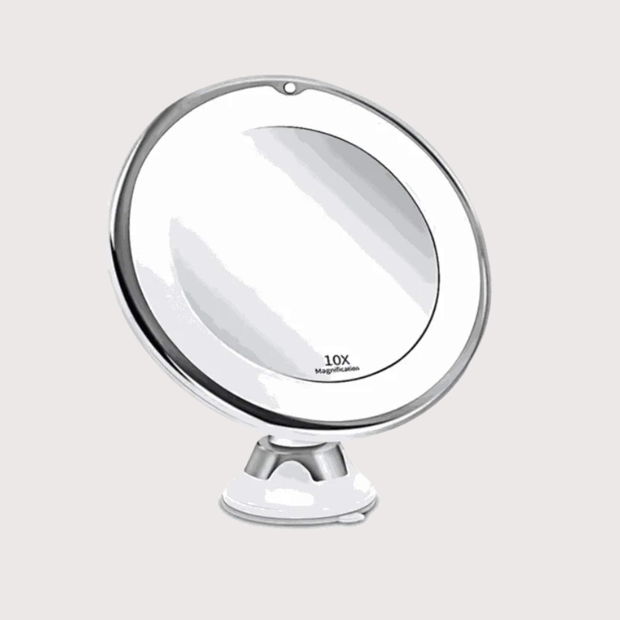 Round makeup mirror with 10x magnification on a white background
