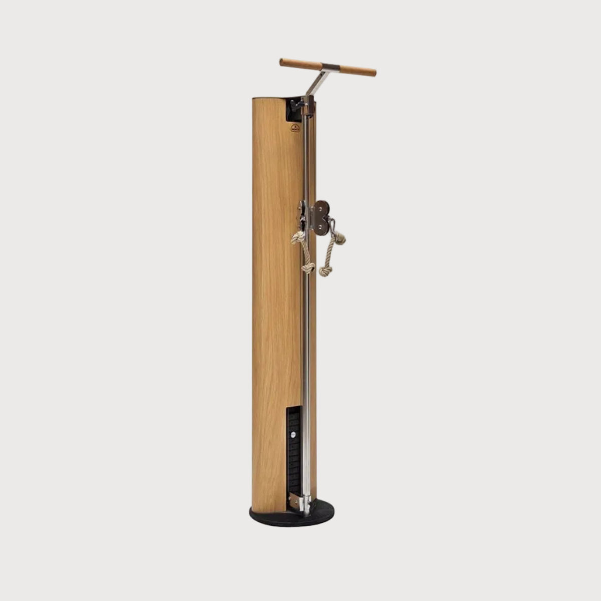 A modern freestanding wooden post with a black circular base, a vertical metal shaft, and a small T-handle mounted near the top, shown on a plain light gray background.