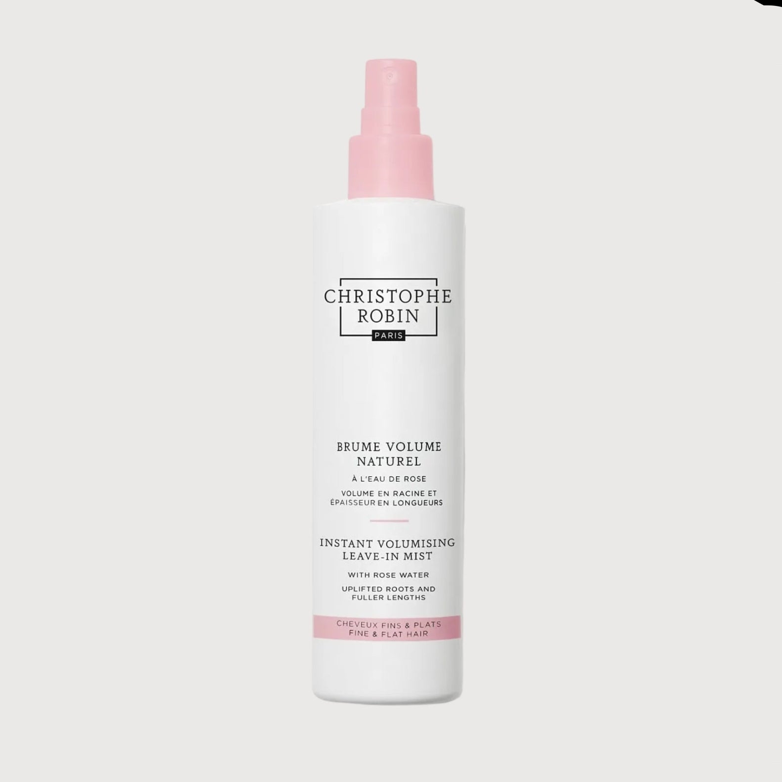 Hair product bottle with pink cap on a white background