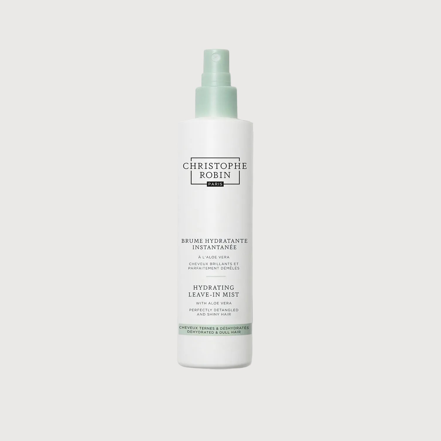 White spray bottle with green label on a white background