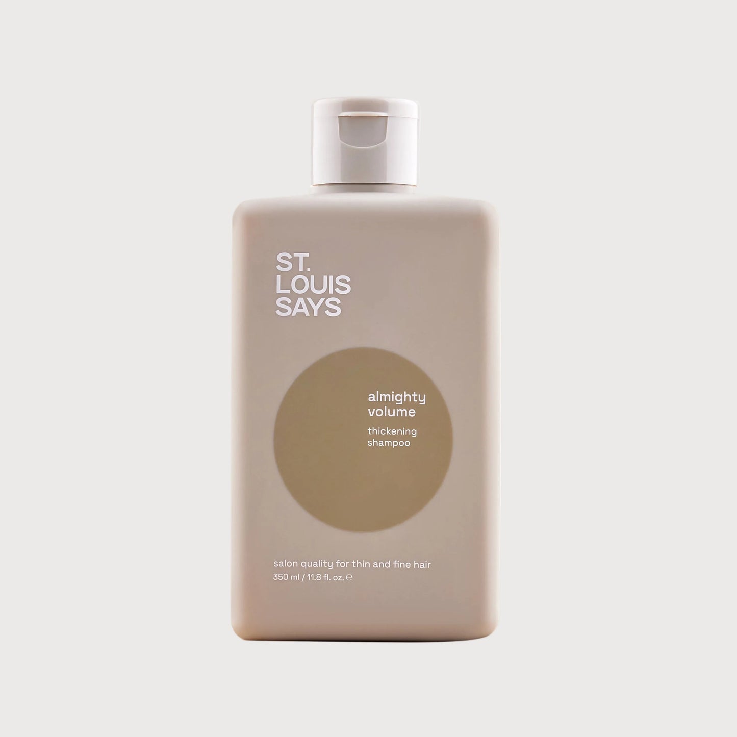 Shampoo bottle labeled 'St. Louis Says' on a light background