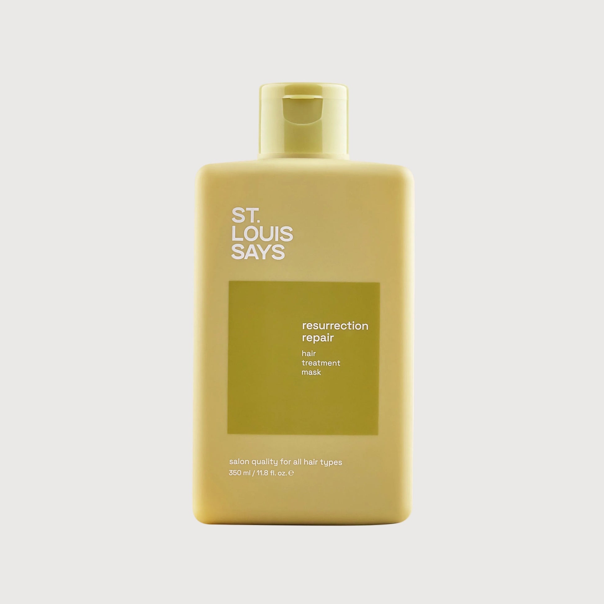 Shampoo bottle labeled 'St. Louis Says' on a white background