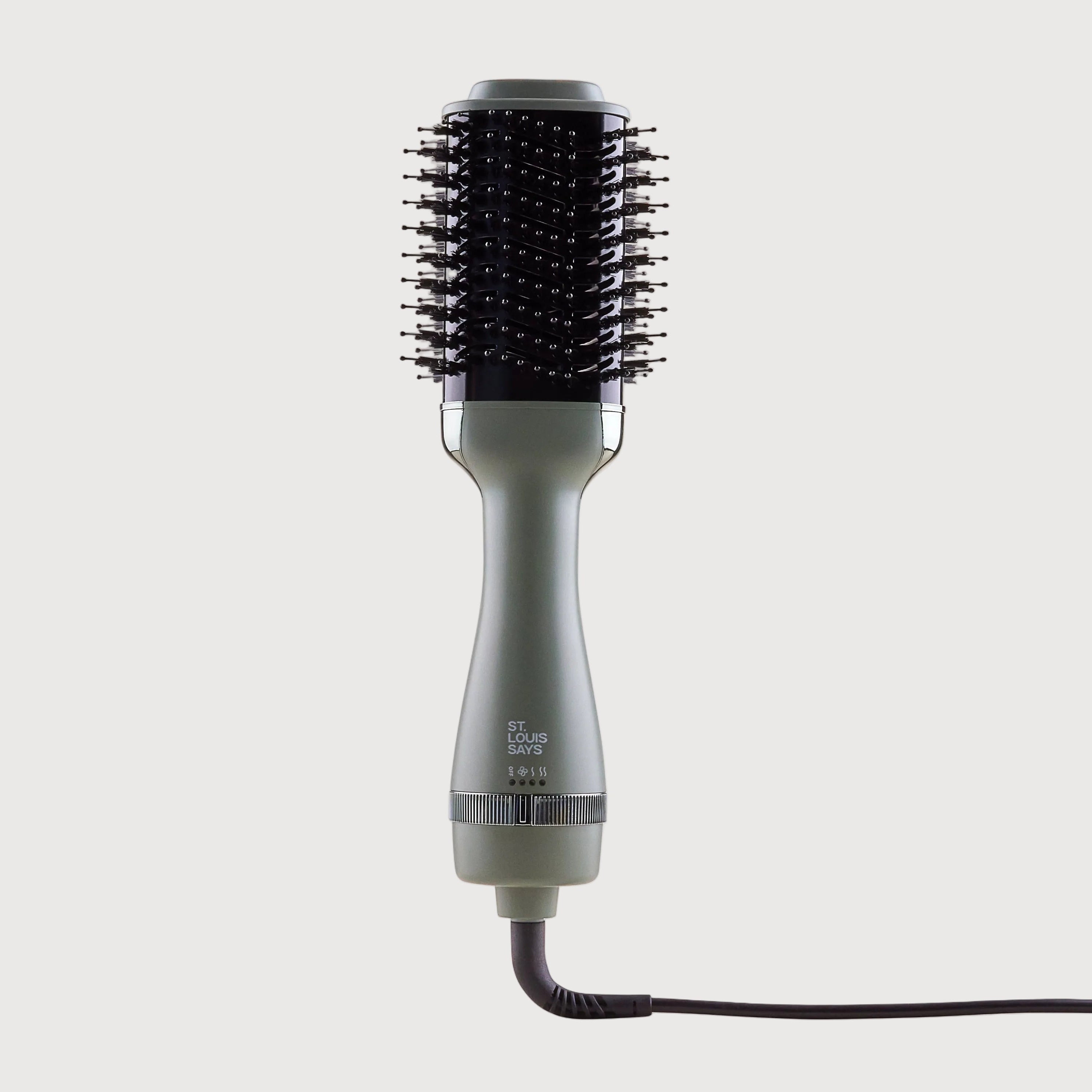 Hair dryer with brush attachment on a white background