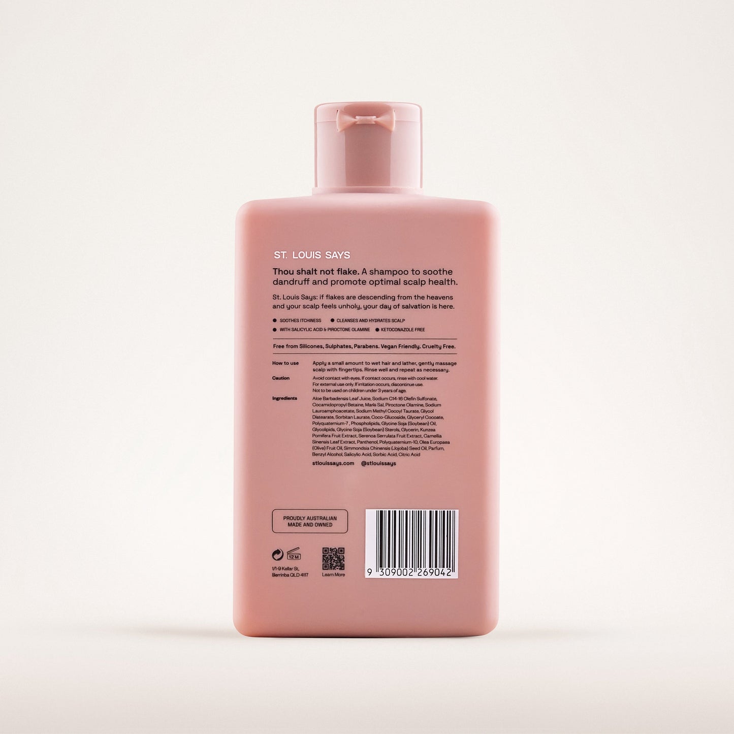Pink shampoo bottle with label on a white background