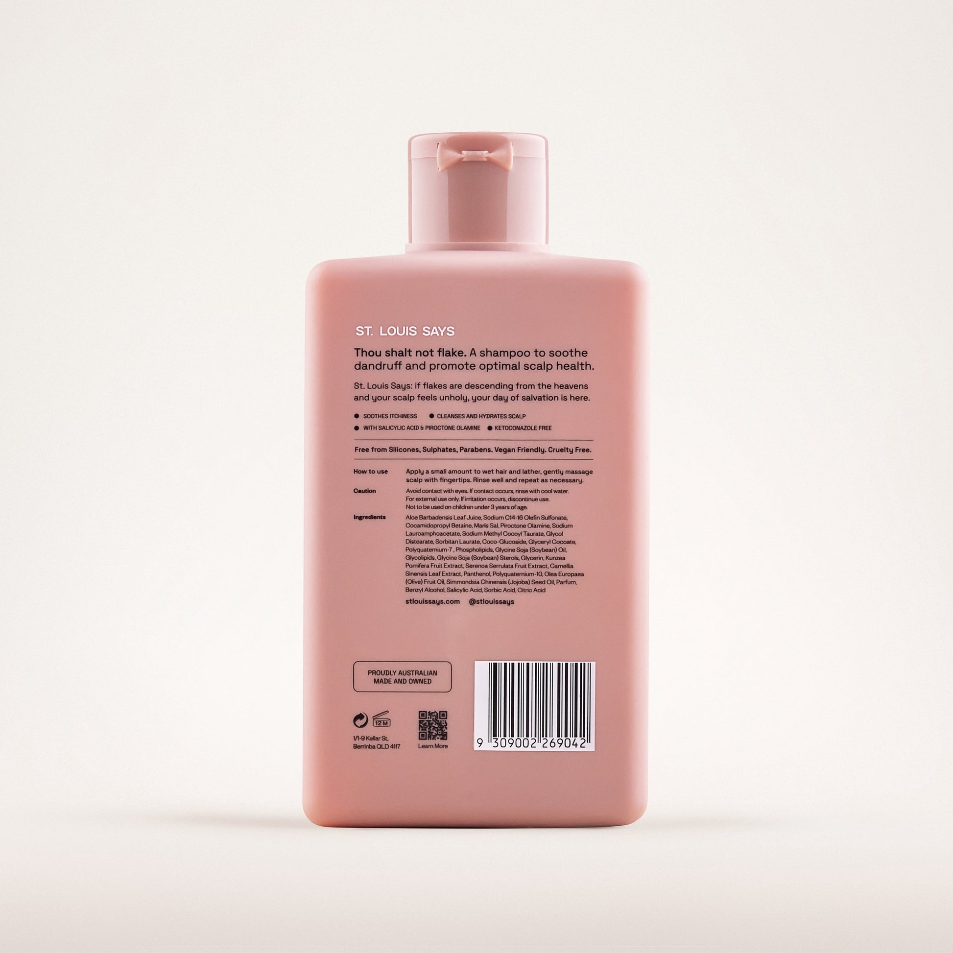 Pink shampoo bottle with label on a white background