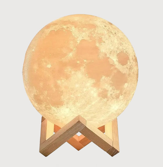 Moon-shaped lamp with color-changing options on a white background