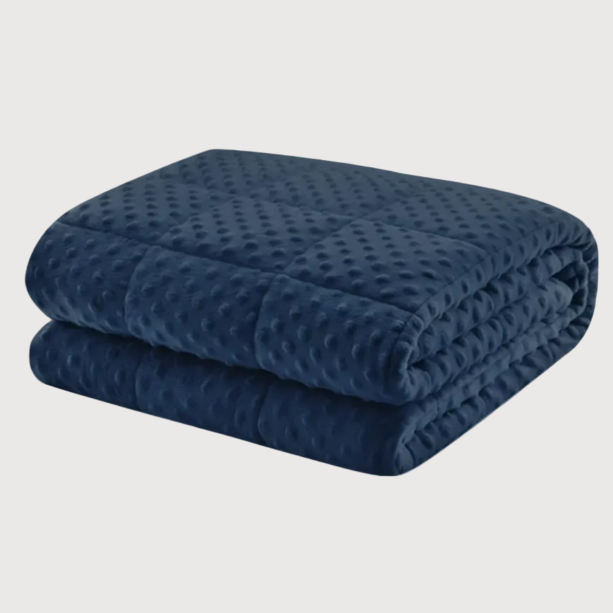 Folded navy blue weighted blanket on a white background