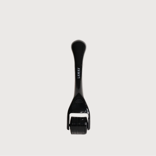 Black derma roller on a white background