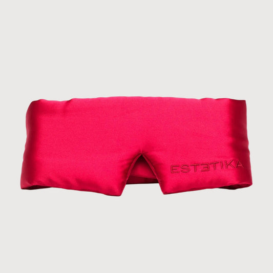 Pink satin eye mask with 'ESTETIKA' branding on a white background