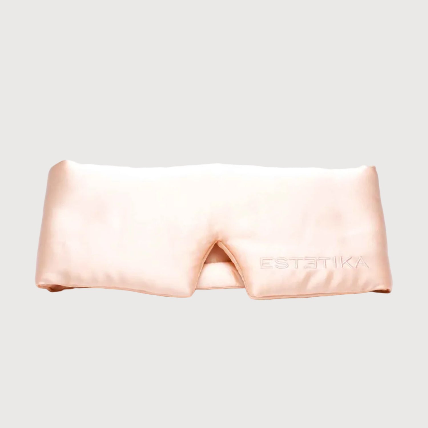 Pink satin headband with 'Estetika' branding on a white background
