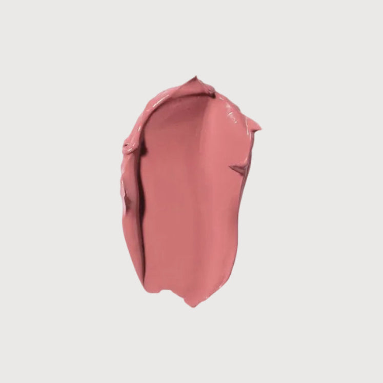 Pink lipstick swatch on a light gray background
