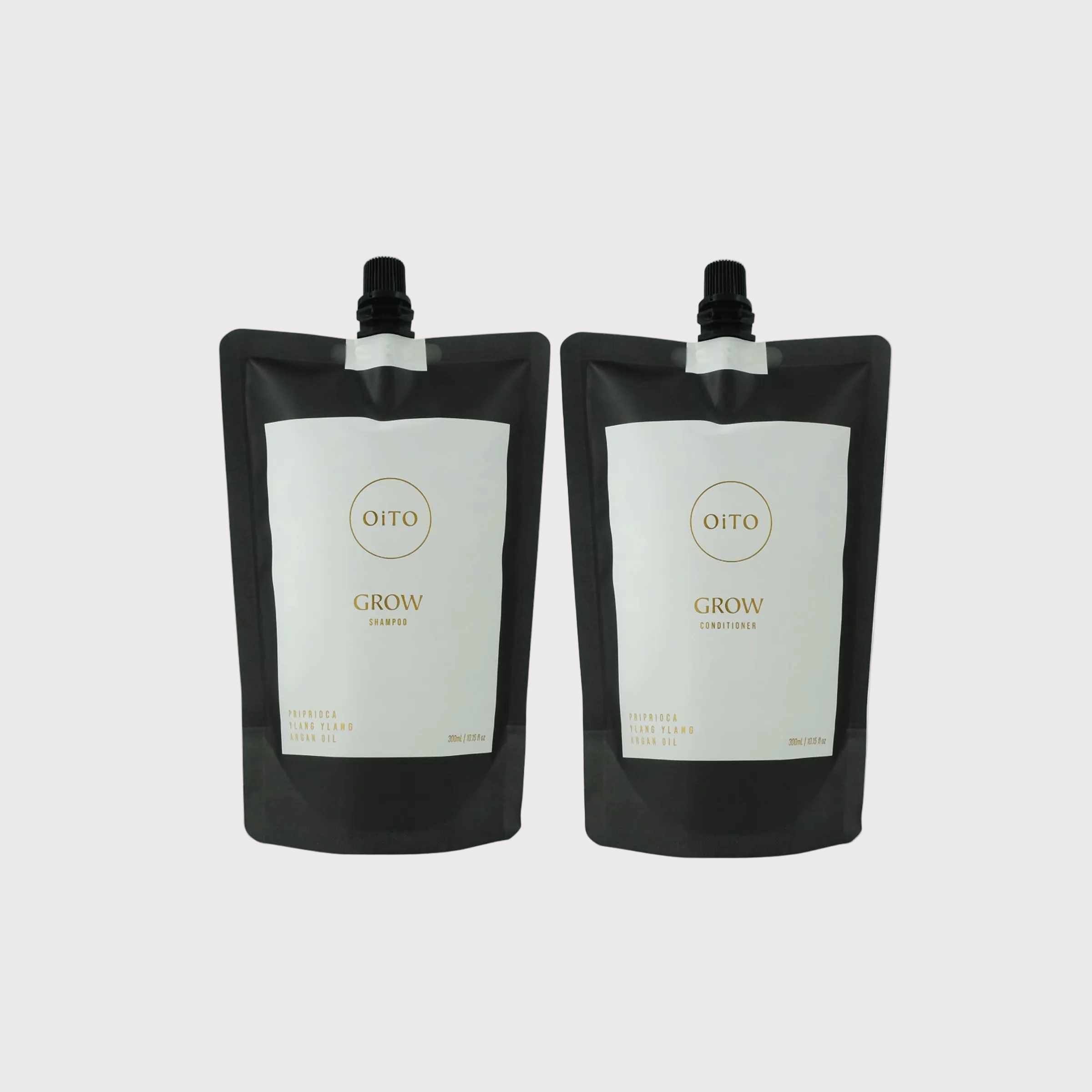 Two black Oito Grow containers on a white background