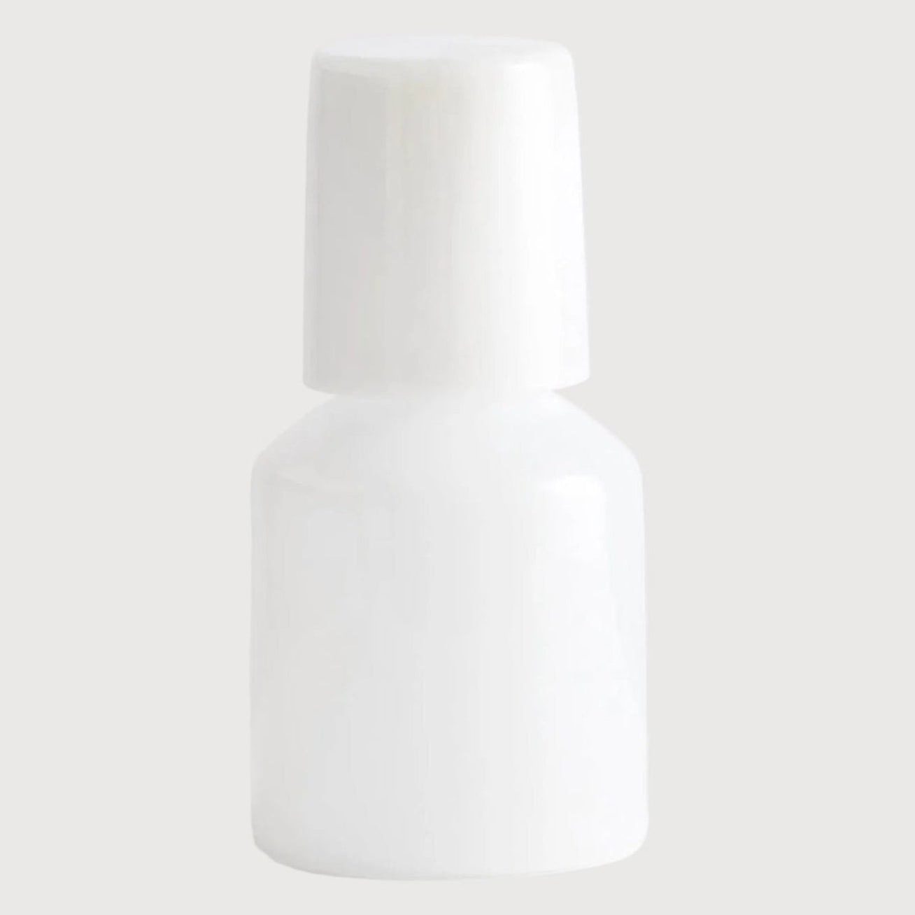 White bottle on a light gray background
