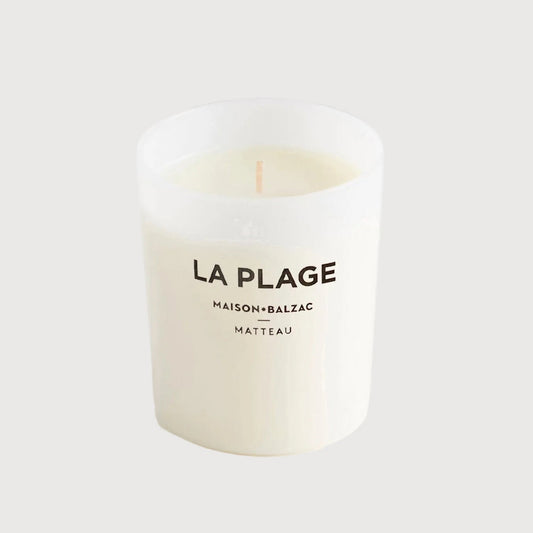 Candle labeled 'La Plage' by Maison Balzac on a white background