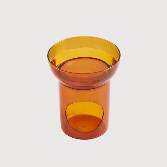 Amber glass tumbler on a white background