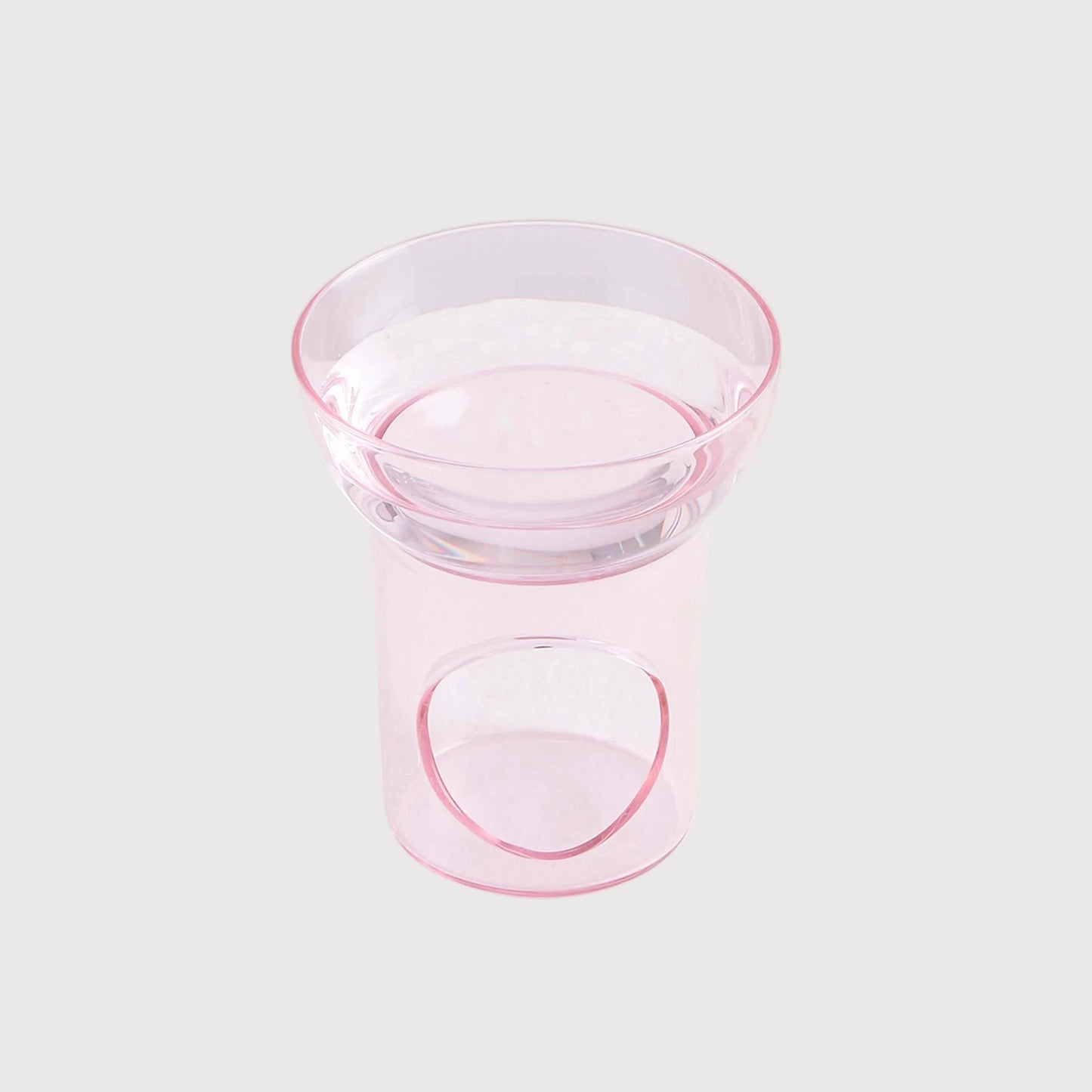 Clear glass bowl with pink rim on a white background
