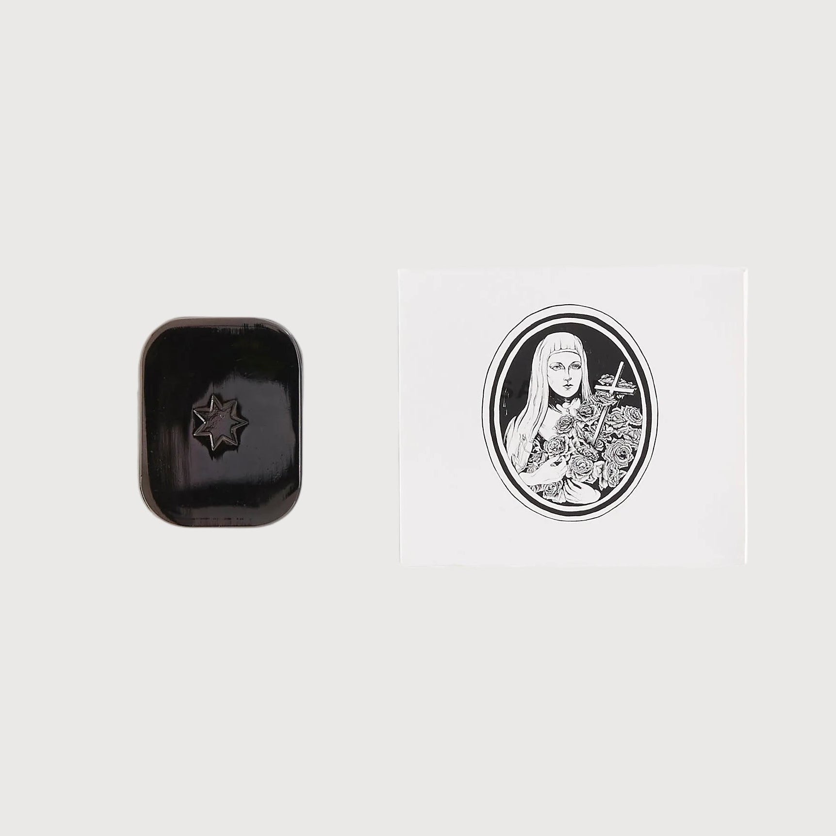 Black rectangular object with a design on a white background