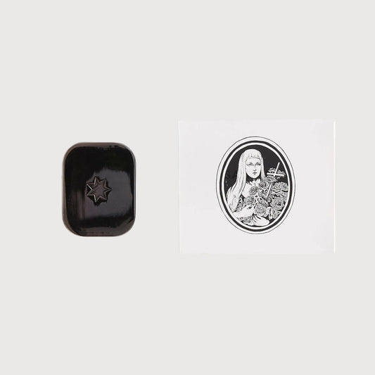 Black rectangular object with a design on a white background
