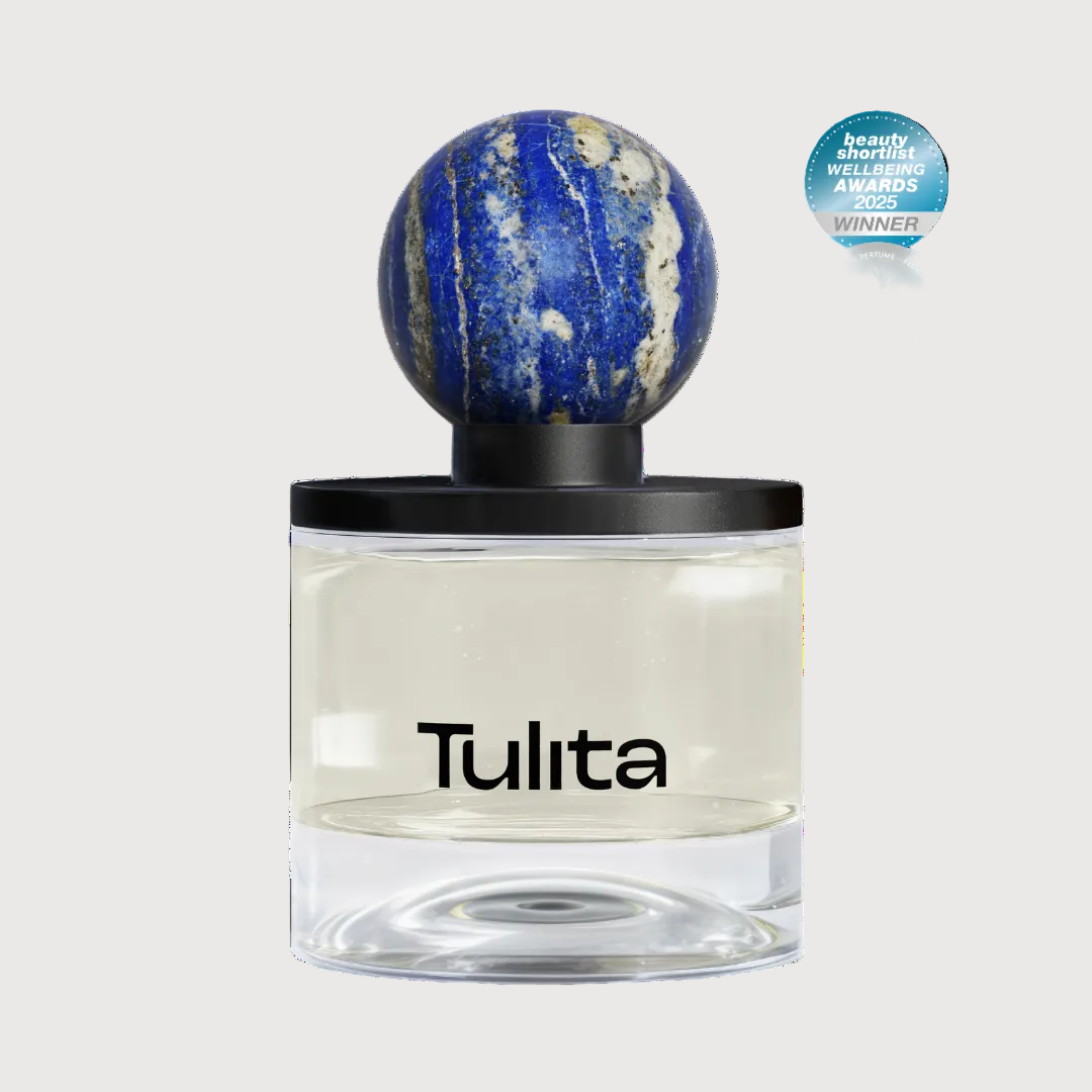 Tulita perfume bottle with a decorative cap on a white background
