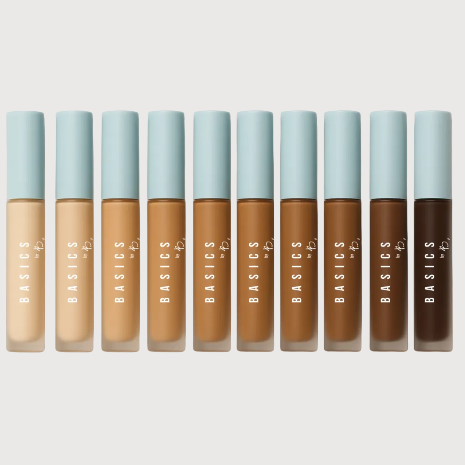 Set of concealer bottles with light blue caps on a white background