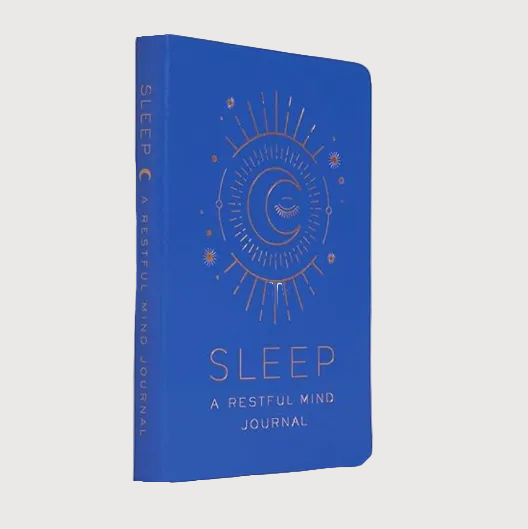 Blue journal titled 'Sleep: A Restful Mind Journal' with celestial design on a white background