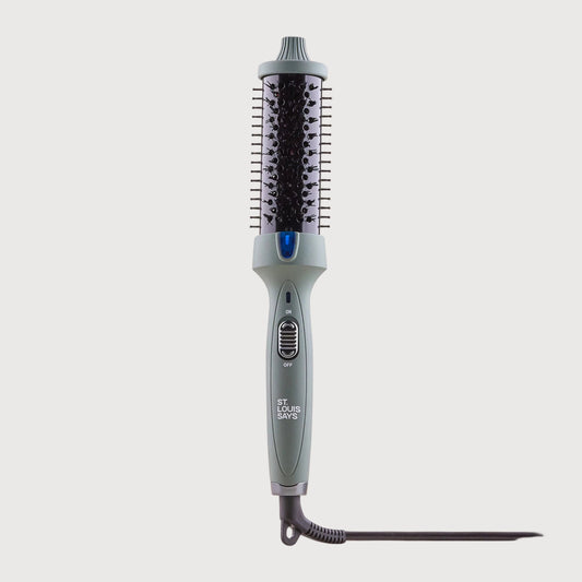 Hair straightener on a light beige background