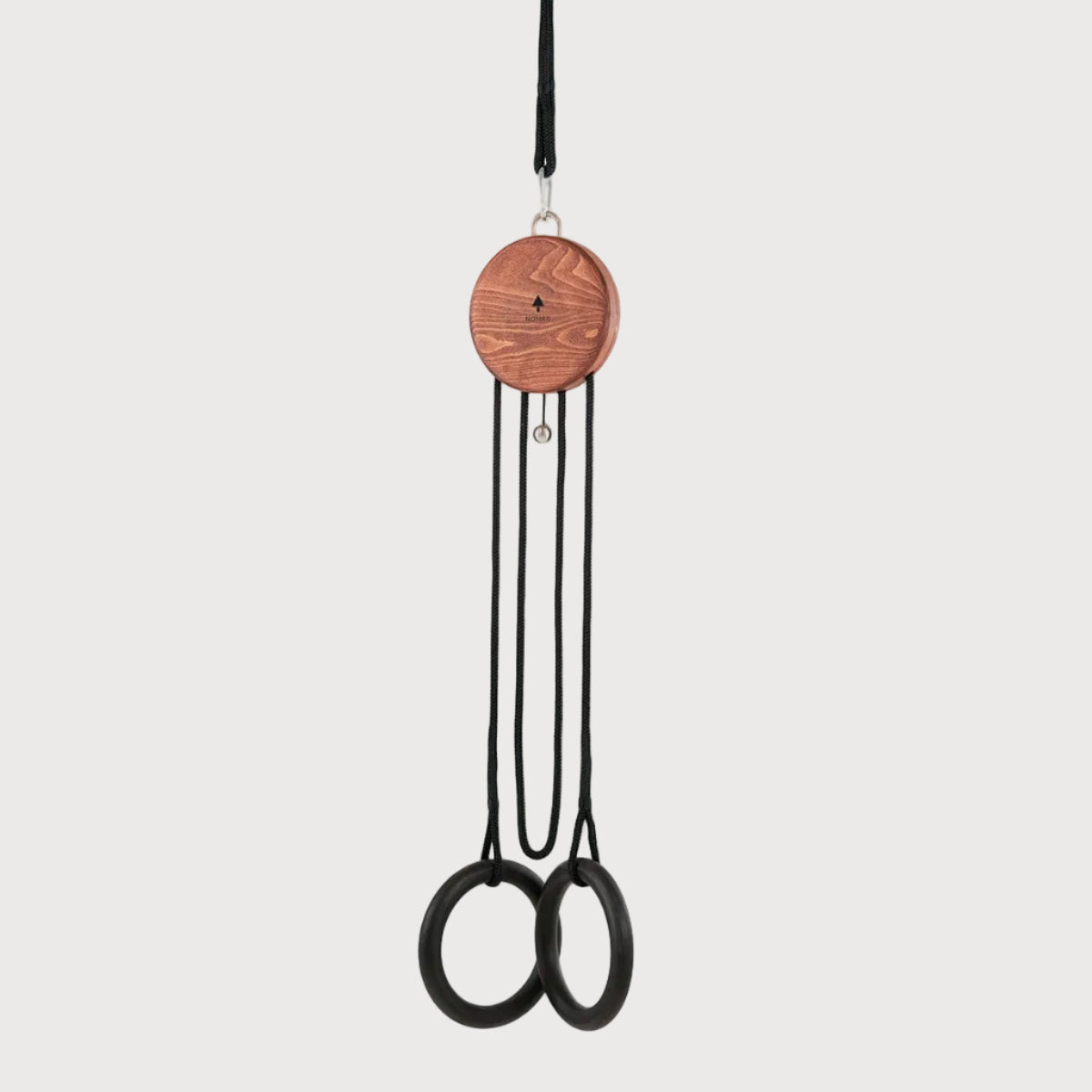 Black scissors with wooden handle hanging on a white background