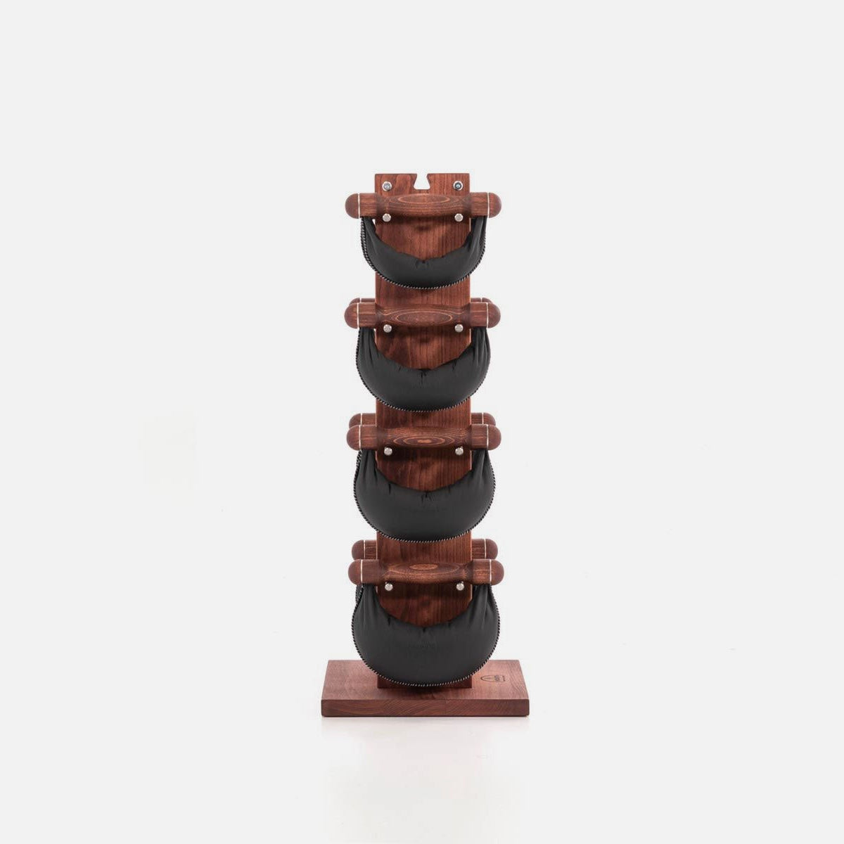 Stack of wooden and metal weights on a white background
